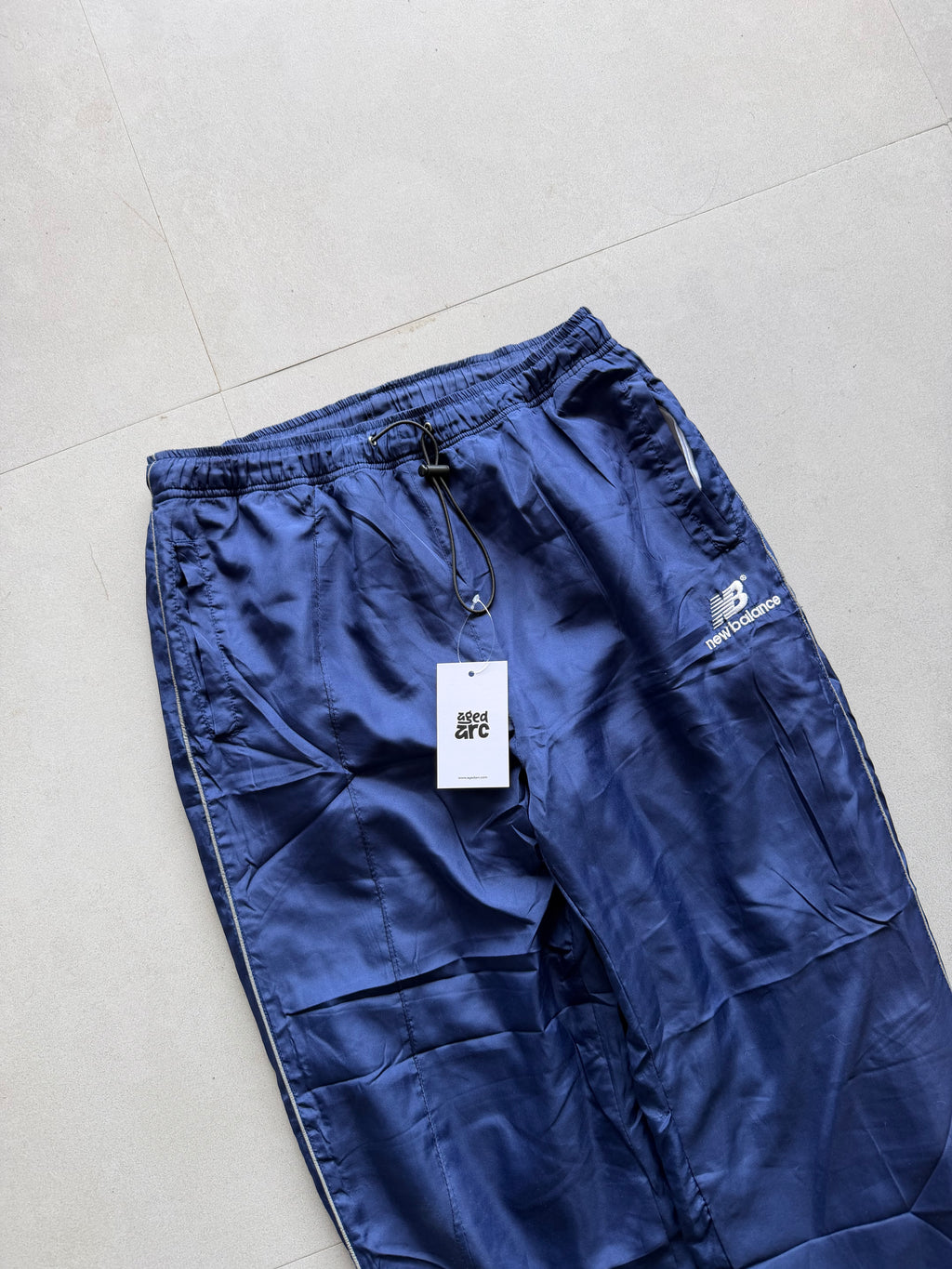 NEW BALANCE BAGGY TRACK PANT6 - S